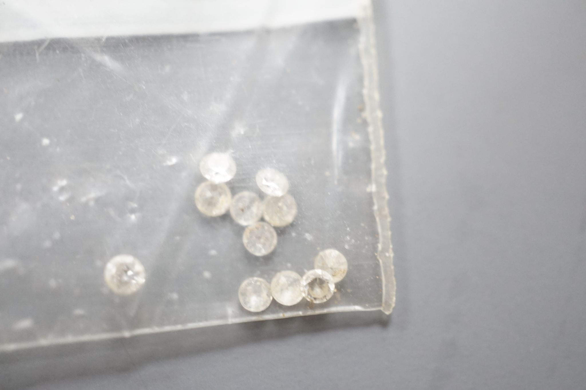 Fourteen small unmounted cut diamonds, total weight approx. 0.58ct.